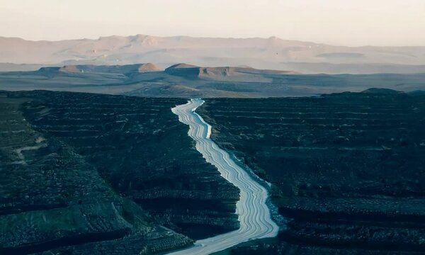 Tracking shot with cool, morning light: The camera starts by focusing on a close-up of a transform fault. It then tracks backward, showcasing the fault&rsquo;s extent and surrounding features with cool, mor