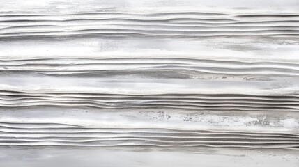 Detailed silver and white horizontal stripes with a metallic sheen, set on a smooth white surface.