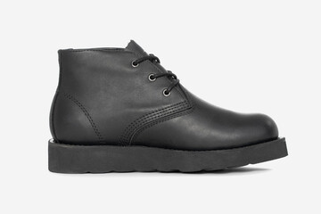 Black leather boots isolated on white background. Classic fashion footwear for everyday, hiking, outdoor activities, autumn and winter seasons.