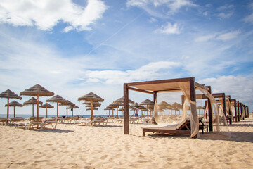 beds and umbrellas on the beach