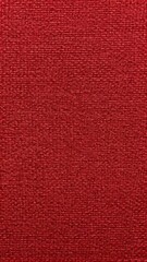 Fototapeta premium Red textured surface with fine weave, ideal for backgrounds, wallpaper or design projects