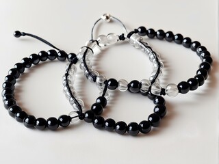 Obraz premium Beautiful Transparent and Black Glass Bead Friendship Bracelet for Couples