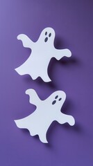 Obraz premium paper ghost on purple background.