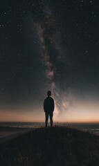 Fototapeta premium Silhouette of person against the Milky Way.