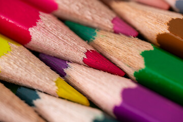 Coloring pencil tips geometric arrangement macro. Diagonal geometric coloring pencils close-up.