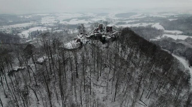 Aerial view ruins of old castle. Winter. Ruin of Hohnstein Castle, Harz mountains, Germany.