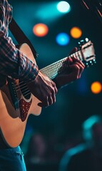Naklejka premium A musician playing an acoustic guitar on stage.