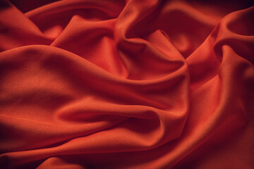 Dark red fabric texture background. Close up.
