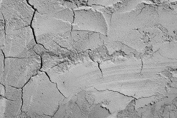 Close-up of cracks in a concrete wall.