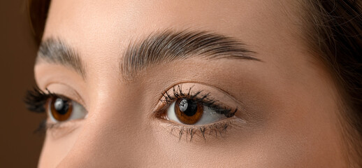 Obraz premium Young woman with beautiful eyebrows, closeup
