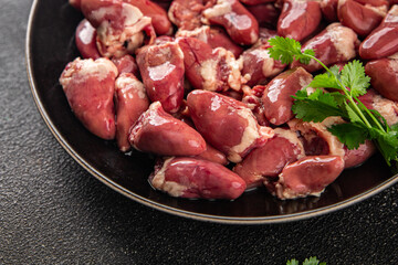 Chicken heart raw chicken offal tasty food dish Fresh delicious gourmet food background on the table rustic food top view copy space top view keto and paleo diet