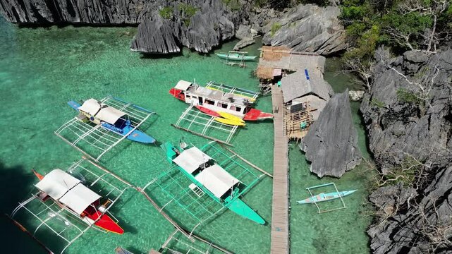 Philippines Tropical Island Jett with Traditional Fishing Boat. Coron Island Philippines Drone Shot