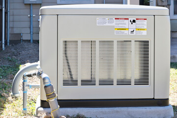 Standby home generator set in residential backyard emergency backup power supply.	