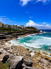 Fototapeta premium Luxurious Cliffside Homes Overlooking the Ocean with waves in Bondi, Australia