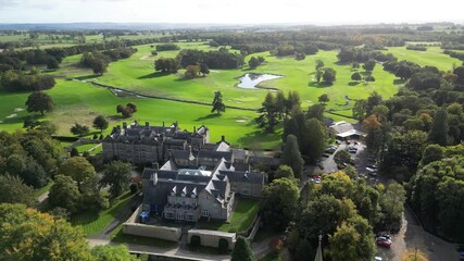 top matfen hall luxurious country house hotel spa located beautiful golf course newcastle england side circling aerial drone luxury estate mansion scenic nature landscape exploration 