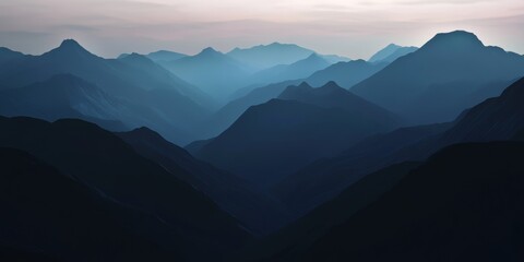 Fototapeta premium Serene Mountain Landscape: Layers of Blue and Gray, Ideal for Nature-themed Design Projects