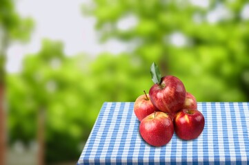 Fresh sweet ripe red apples on table in farming.