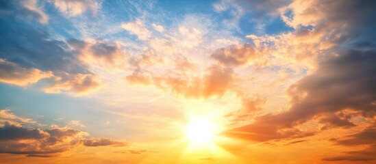 Obraz premium Beautiful sunset with orange and blue clouds.