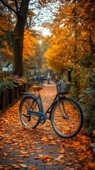Fototapeta premium Autumnal Bike Ride - Photo of a Bicycle Parked on a Path Covered in Fallen Leaves