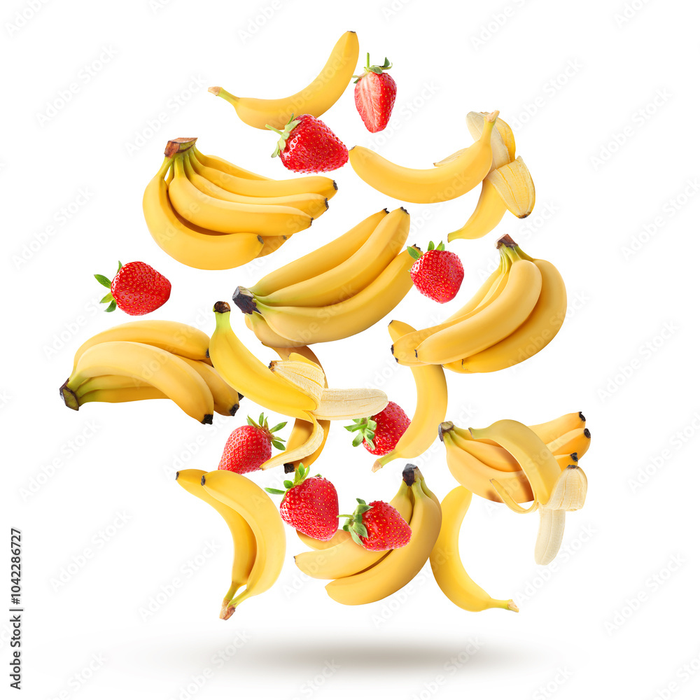 Sticker Fresh bananas and strawberries falling on white background