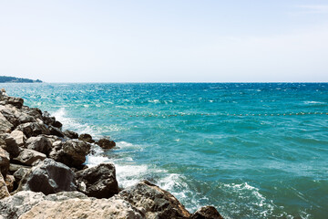 Seaside Rocky Shore under Blue Sky