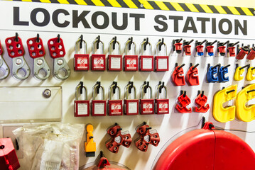 A close-up of a 'lockout station' displaying safety equipment used to securely lock out valves and other machinery during maintenance. 