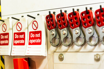 A close-up of a 'lockout station' displaying safety equipment used to securely lock out valves and other machinery during maintenance. 