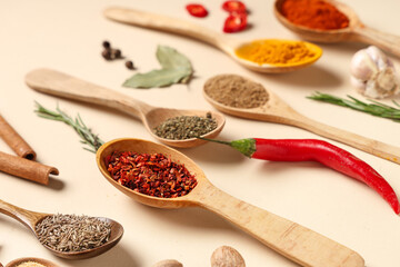 Composition with wooden spoons of fresh aromatic spices on color background