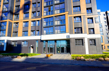 New modern residential architecture. Exterior Of residential building in residential area. New Condominium complex in Ecological district. Modern facade of a residential apartments building.