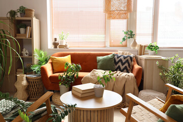 Interior of modern living room with green houseplants