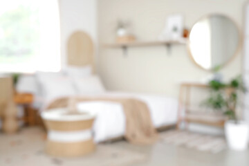 Stylish interior of modern bedroom. Blurred view