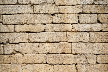 Obraz premium Old walls of the ancient fortress of Mycenae in Peloponnese, Greece. Mycenae was one of the largest fortresses in ancient Greece during the Bronze Age and played an important role in the Trojan War