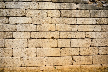 Old walls of the ancient fortress of Mycenae in Peloponnese, Greece. Mycenae was one of the largest fortresses in ancient Greece during the Bronze Age and played an important role in the Trojan War