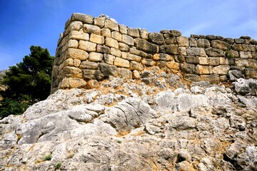 Remains of the fortification walls of Mycenae on Peloponnese in Greece. Mycenae was one of the largest citadels in Ancient Greece during the Bronze Age and played an important role in the Trojan War