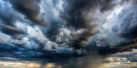 Obraz premium Dark rain clouds with light background clouds at a tilted angle