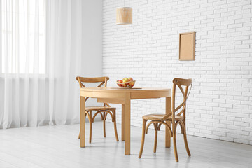 Table with basket of apples in dining room