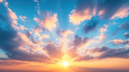 A vibrant sunset with orange, pink, and blue hues fills the sky with fluffy clouds and golden rays of sunlight.