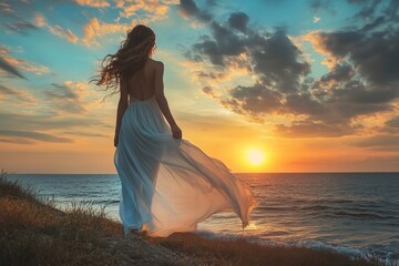 Young woman with long wavy hair, wearing a flowing dress, standing on the shore and looking at the sunset over the ocean 7