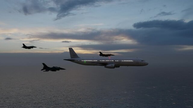 Combat aircraft escorting a passenger aircraft.