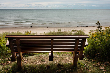 Looking out over Lake Michigan from behind a park bench at the picnic area of Harrington Beach State Park, Belgium, Wisconsin, on a mid-September morning.