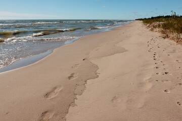 The incoming waves of Lake Michigan wash away the footprints in the sand along the beach at Kohler-Andrae State Park, Sheboygan, Wisconsin in mid-September.