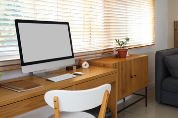 Workplace with computer in interior of living room
