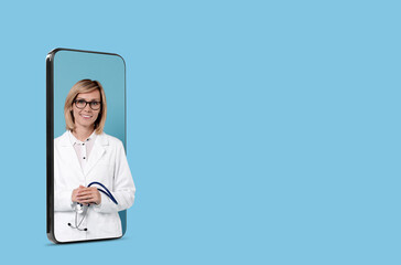 Online medical consultation. Doctor with stethoscope on smartphone screen against light blue...