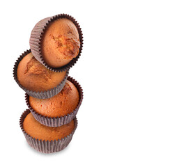 Stack of tasty muffins on white background. Space for text