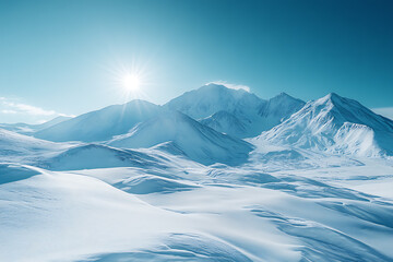 A stunning view of a snow-covered mountain range beneath a clear blue sky, with sunlight illuminating the peaks and showcasing the beauty of winter.

