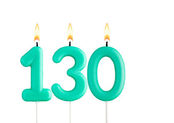 Green birthday candle on white background - Candle number 130