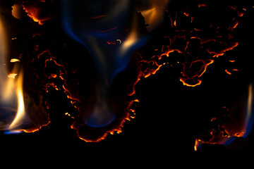 burning paper, glowing edge of paper on a black background.