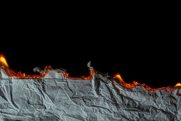 burning paper, glowing edge of paper on a black background