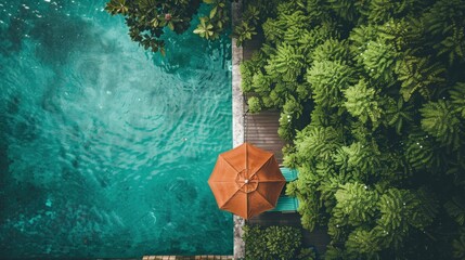 a serene poolside seating area, with outdoor furniture and a sun umbrella set up beside a sparkling pool, surrounded by green trees and bushes