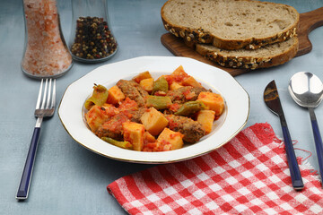 Traditional Homemade Turkish Food Kofte - Kofta with Tomato Sauce and Potatoes. (Turkish name; Izmir kofte)